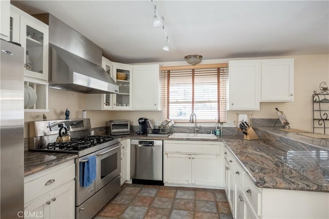 kitchen with stainless steel appliances, sink, white cabinets, and wall chimney exhaust hood