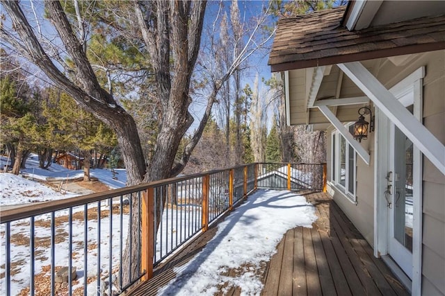 view of snow covered deck