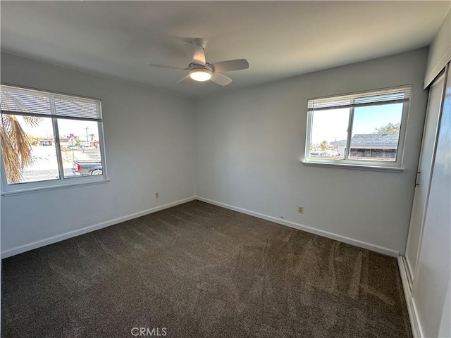 carpeted empty room with ceiling fan