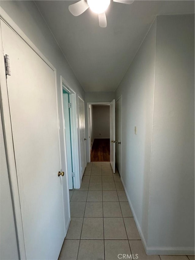 hallway featuring light tile patterned flooring