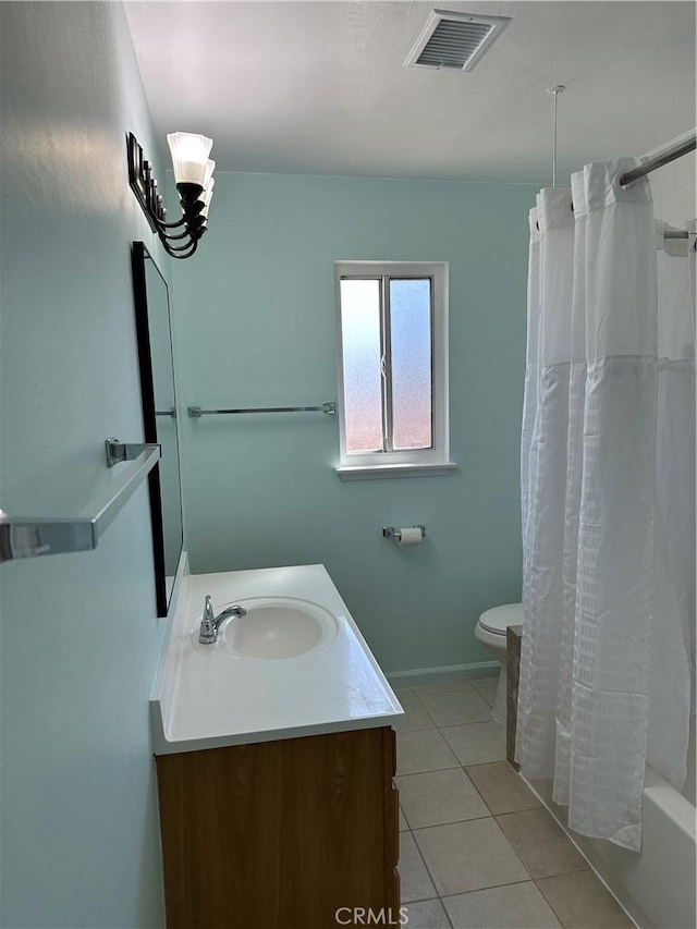 full bathroom with tile patterned floors, vanity, toilet, and shower / bath combo