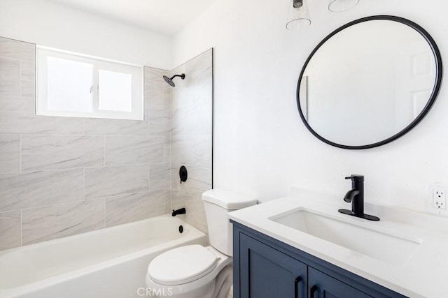 full bathroom with vanity, toilet, and tiled shower / bath combo