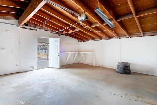 interior space with lofted ceiling and concrete floors