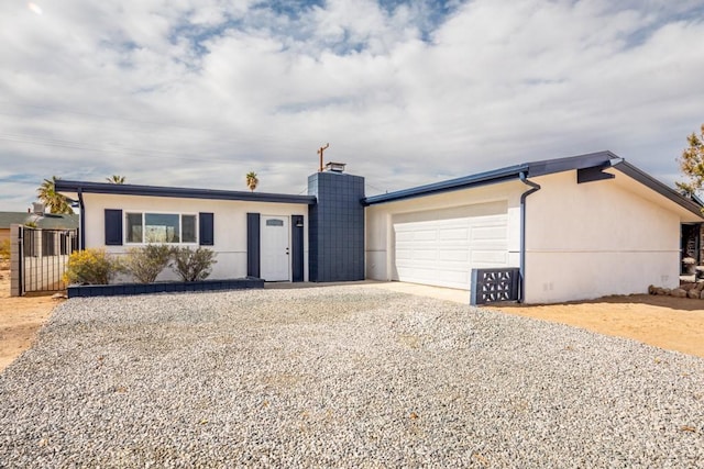 ranch-style home with a garage