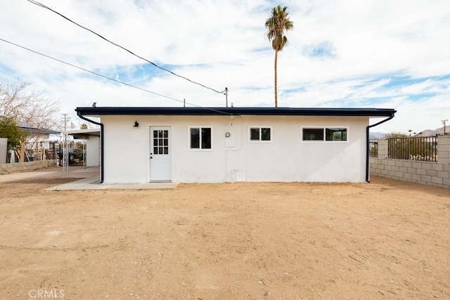 back of property featuring a patio