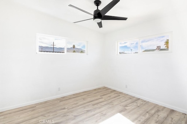 spare room featuring ceiling fan and light wood-type flooring