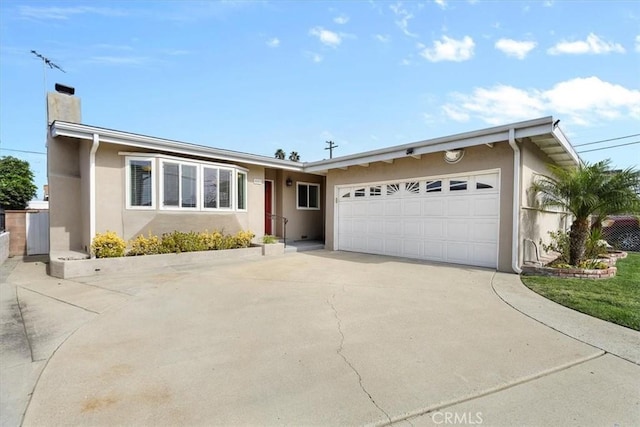 ranch-style house featuring a garage