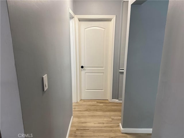 hall with light wood-type flooring