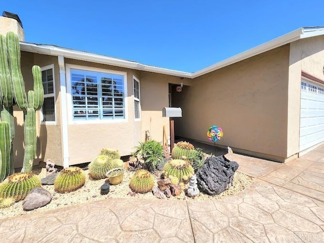 view of property exterior featuring a garage