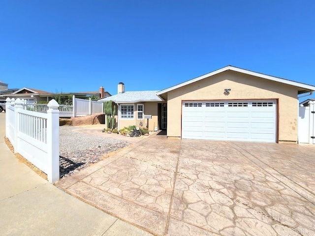 ranch-style house featuring a garage