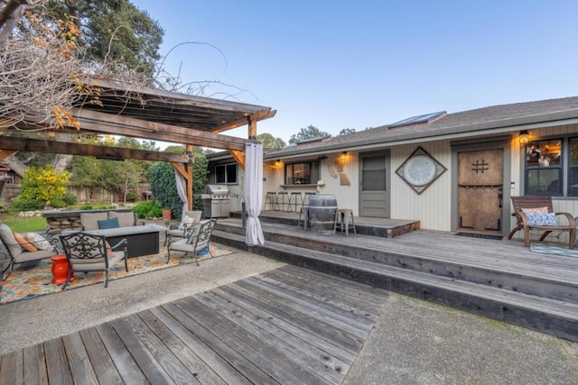 deck with an outdoor living space, area for grilling, and a pergola