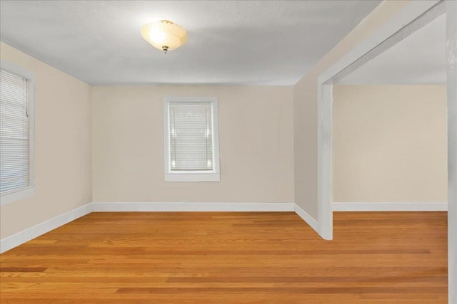 spare room featuring light wood-type flooring