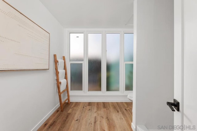 spare room with light wood-type flooring