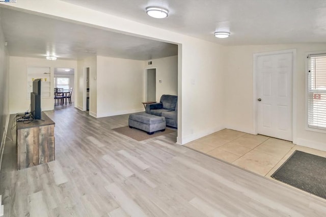 foyer featuring a wealth of natural light and light hardwood / wood-style floors