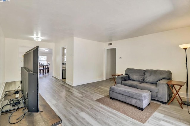 living room featuring light wood-type flooring