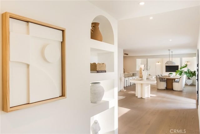 corridor featuring hardwood / wood-style floors