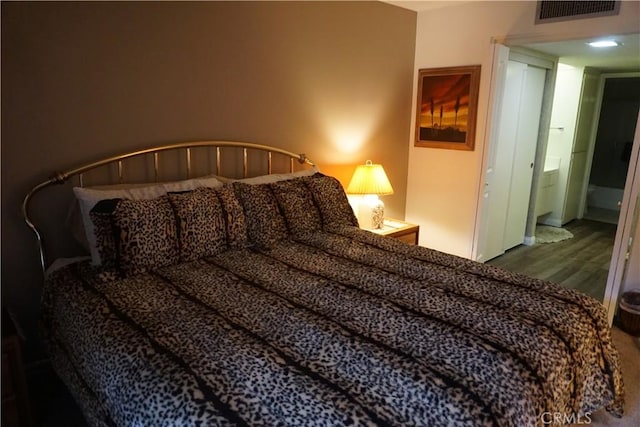 bedroom featuring wood-type flooring