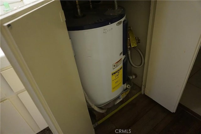 utility room featuring water heater