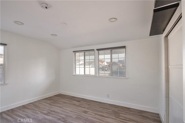 spare room featuring hardwood / wood-style flooring