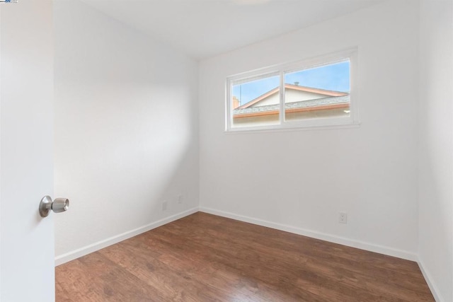 unfurnished room featuring wood-type flooring