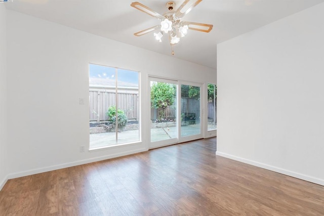 unfurnished room featuring hardwood / wood-style floors and ceiling fan