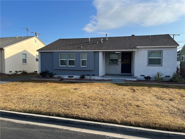 ranch-style house with a front lawn