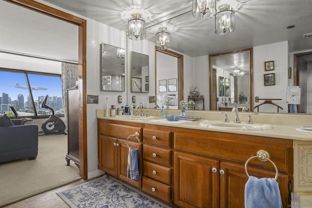 bathroom with vanity and a notable chandelier