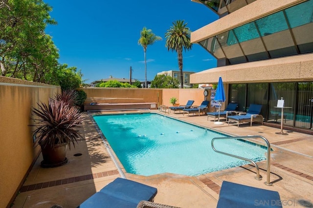 view of swimming pool with a patio