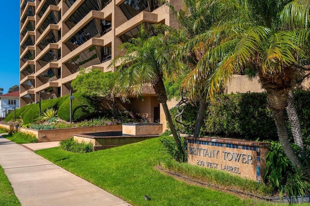 view of home's community with a yard