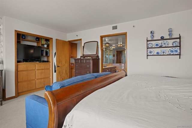 carpeted bedroom featuring connected bathroom