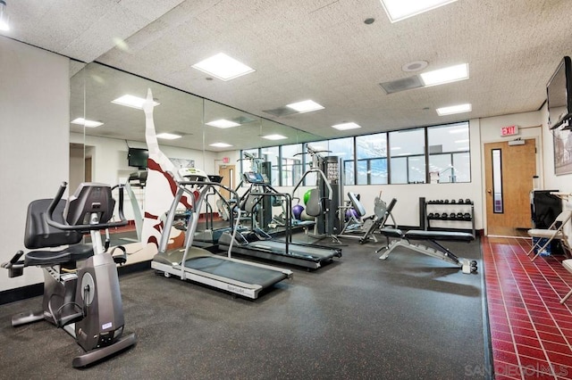 gym with a textured ceiling