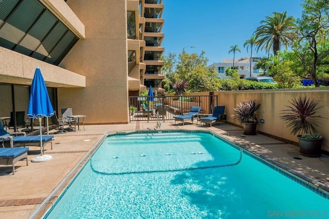 view of swimming pool featuring a patio area