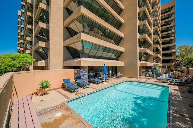 view of swimming pool with a patio