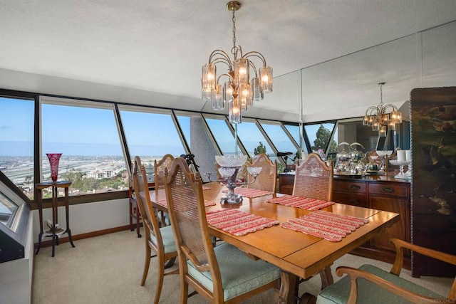 carpeted dining room featuring a notable chandelier