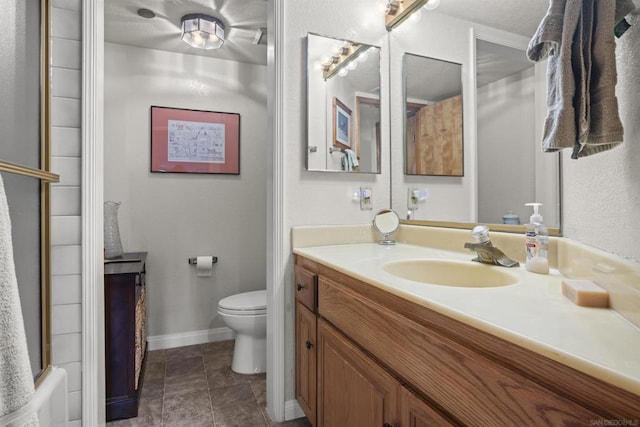 full bathroom with vanity, tile patterned flooring, shower / bath combination with curtain, and toilet