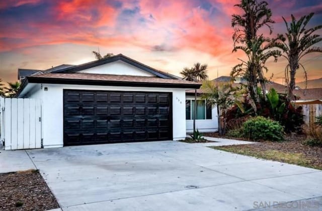 ranch-style home featuring a garage