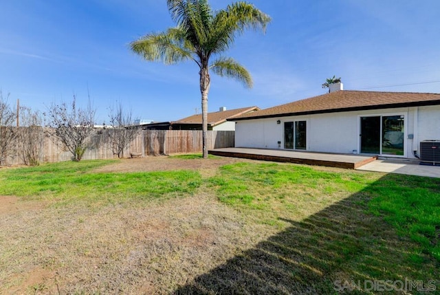 view of yard featuring a patio area and central air condition unit