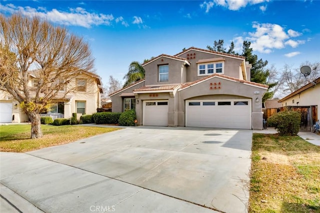 mediterranean / spanish-style house with a garage and a front lawn