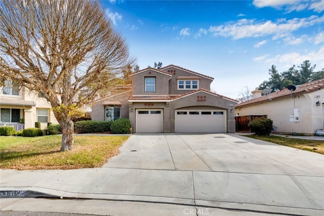 view of front of home with a garage and a front yard