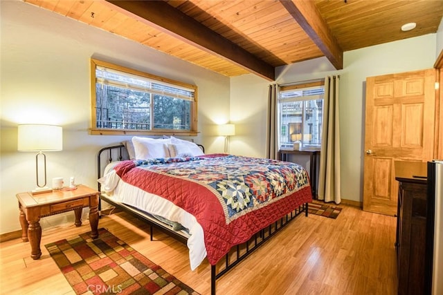 bedroom with wood ceiling, light hardwood / wood-style flooring, and beamed ceiling