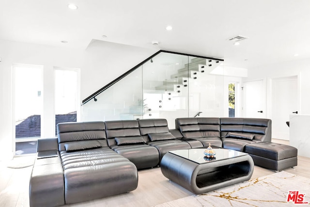 living room with light hardwood / wood-style flooring