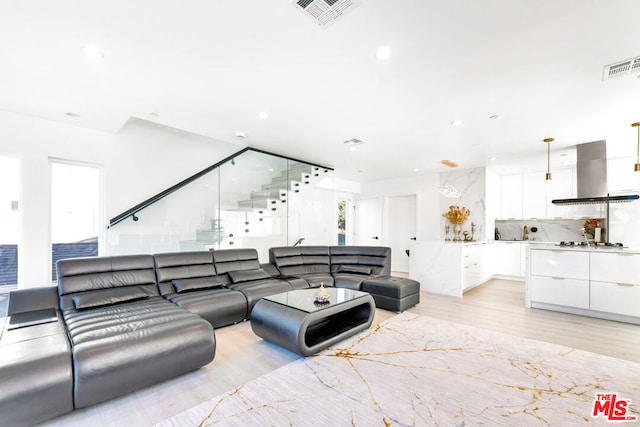 living room with light hardwood / wood-style flooring