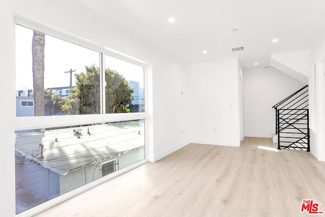 unfurnished living room with light hardwood / wood-style floors