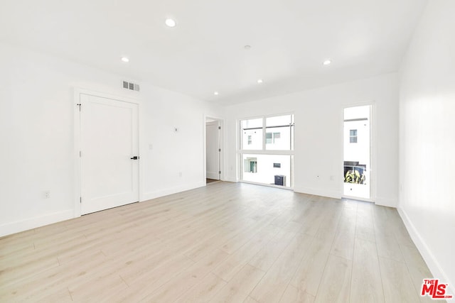 unfurnished living room featuring light wood-type flooring