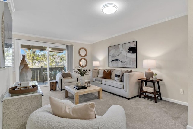 carpeted living room featuring ornamental molding