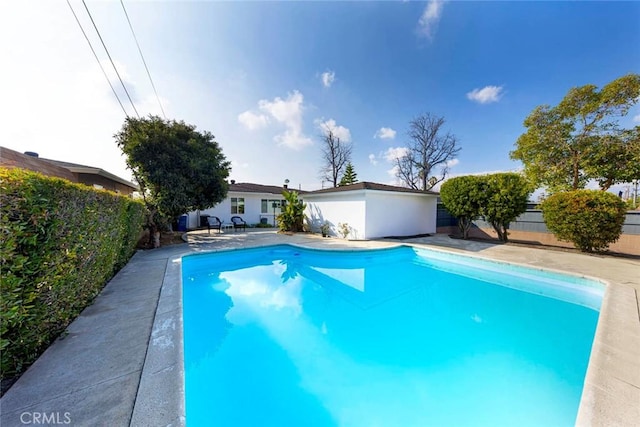 view of pool with a fenced backyard, a fenced in pool, and a patio