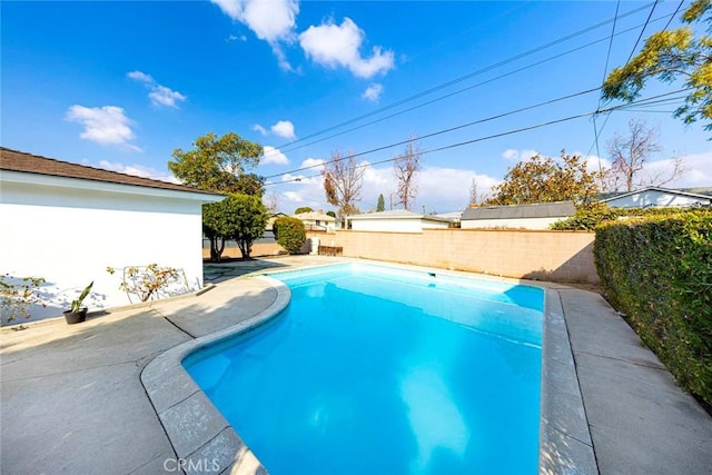 view of swimming pool with a patio area, a fenced backyard, and a fenced in pool