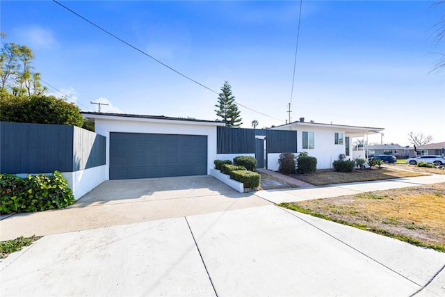 view of front of property featuring fence and stucco siding