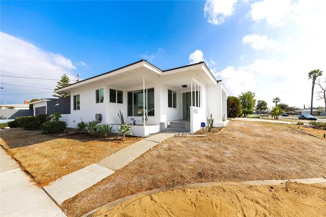 view of front of property featuring stucco siding