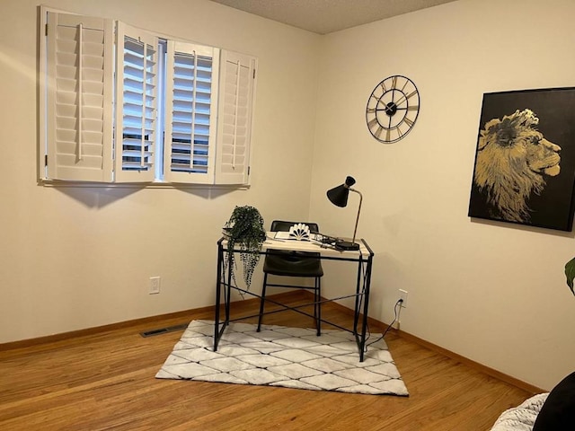 office space with light hardwood / wood-style floors